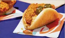  ?? COURTESY OF TACO BELL ?? Taco Bell’s new Spicy Crispy Chicken Sandwich Taco is a petite size, which means it can serve as a snack or a meal.