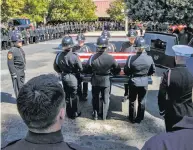  ?? Marty Bicek / Associated Press ?? Fire personnel carry coffin of equipment operator Braden Varney, who died July 14 in the Ferguson Fire.