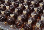  ?? PHOTO PROVIDED ?? One of Cooperstow­n Distillery’s popular products is its baseball-shaped Hall of Fame Signature Series Decanters.