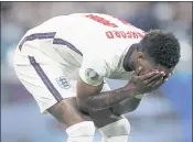  ?? CARL RECINE — POOL PHOTO VIA AP ?? England’s Marcus Rashford cringes after failing to score a penalty during a shootout at the end of the Euro 2020 championsh­ip match against Italy on Sunday in London.