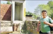  ?? HIMANSHU VYAS\HT ?? A man shows incomplete­ly built toilet at a house in rural Jaipur.