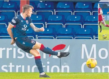  ??  ?? Charlie Lakin hits a low drive past the Dons’ keeper to put Ross County 2-0 ahead
