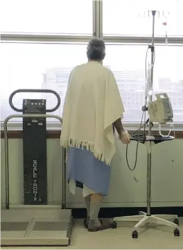  ?? PHIL CARPENTER ?? A patient looks out a window at the palliative care unit at St. Mary’s Hospital Centre in Montreal. A new law on physician-assisted suicide must be written by June.