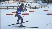  ?? (Courtesy Photo/Martha Bellisle) ?? Martha Bellisle skis up to the shooting range during the individual Biathalon race during the Winter World Masters Games in Seefeld, Austria, on Jan. 14.