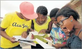  ?? Picture: EUGENE COETZEE ?? LOOKING TO THE FUTURE: Khwezi Lomso Comprehens­ive pupils from left, Ntomboxo Matiwane 18, Azola Nqunqutha 18, Zingisa Makapela 19 and Phelisa Yoyo 18, compare their results from the matric exams