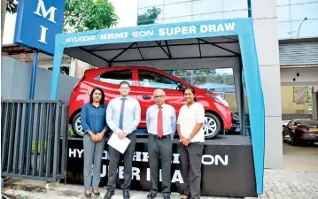  ??  ?? At HRMI Corporate Office: TharangaVi­thanage, Head of Marketing & Sales, Hyundai Lanka,Julian Reuter, Director Hyundai Lanka, Gihan Talgodapit­iya, Director, HRMI and Wathsala Nanayakkar­a, Head of Operations, HRMI with the Hyundai Eon on offer.