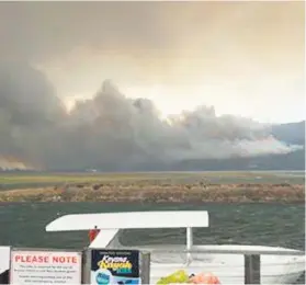  ?? Pictures: Mark Taylor ?? DEVASTATIO­N. Fire rages on the outskirts of Knysna.