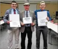  ?? DAN SOKIL — DIGITAL FIRST MEDIA ?? North Penn High School wrestlers Ryan Cody, left, and Colin Shannon, right, pose with wrestling coach Robert Shettsline after the three received proclamati­ons from the district school board on April 20.
