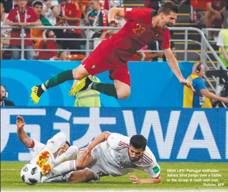  ??  ?? HIGH LIFE: Portugal midfielder Adrien Silva jumps over a tackle in the Group B clash with Iran.
Picture: AFP