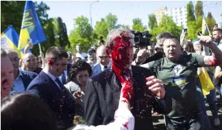  ?? ?? Russian Ambassador to Poland, Ambassador Sergey Andreev is covered with red paint in Warsaw, Poland, Monday, May 9, 2022.