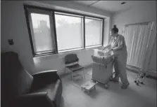  ?? BARRY GRAY, THE HAMILTON SPECTATOR ?? The Neonatal Intensive Care Unit at St. Joseph’s Hospital cares for babies that suffer from NAS. Here, student nurse Sarah Van Allen works in the unit.