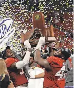  ?? JASON GETZ/ USA TODAY ?? Bama’s Will Anderson Jr. and Phidarian Mathis lift the SEC trophy, the eighth under Nick Saban.