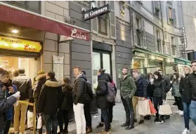  ??  ?? FRIED BREAD PLEASE. Typical line at Panzerotti Luini.