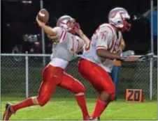  ?? Photo by Mike Bucher ?? Bristol QB Trevor Leone, left, has good protection on a Warriors’ aerial in last Friday’s win over New Hope-Solebury.