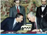  ?? — AFP ?? PARIS: This file photo shows French Prime Minister Edouard Balladur (right) talking with Defense Minister Francois Leotard during a meeting on national consultati­on of youth.