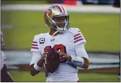  ?? NHAT V. MEYER — BAY AREA NEWS GROUP FILE ?? San Francisco 49ers starting quarterbac­k Jimmy Garoppolo (10) prepares to throw before their game against the Los Angeles Rams at Levi’s Stadium in Santa Clara on Sunday, Oct. 18, 2020.