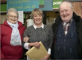  ??  ?? It was a sad farewell for Mary and Oliver Doyle, pictured with postmistre­ss Áine.