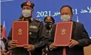  ?? Photograph: AFP/Getty Images ?? Gen Abdel Fattah al-Burhan, left, and Abdalla Hamdok at the signing of the deal to release the detained Sudanese prime minister.