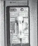  ?? FILE PHOTO/BLOOMBERG NEWS ?? Pay phones still worked after Sandy struck and took out cell towers.