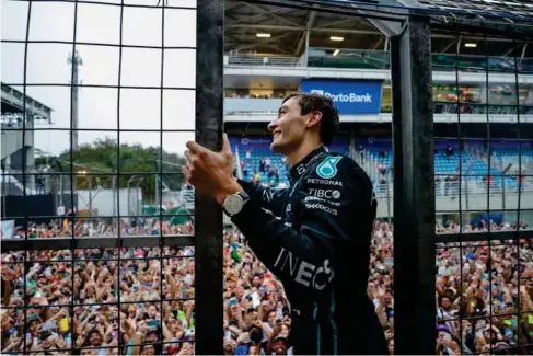  ?? (AP) ?? George Russell acknowledg­es the fans in Interlagos yesterday
