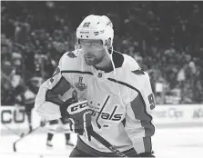  ?? HARRY HOW/GETTY IMAGES ?? So-so ice conditions at T-Mobile Arena in Las Vegas in Game 1 affected skilled players like Evgeny Kuznetsov, who says he had difficulty corralling the many bouncing pucks.