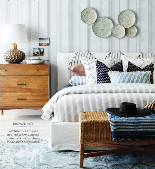  ??  ?? ‘Mid-Century’ eucalypt and acacia-veneer dresser, $999, West Elm. ‘Joe’ queen-size bed with linen upholstery, $2950, MCM House. Malawian bamboo
bench, $495, Orient House. ON DRESSER ‘Coral Moon’ metal table lamp with linen shade, $385, and vintage...