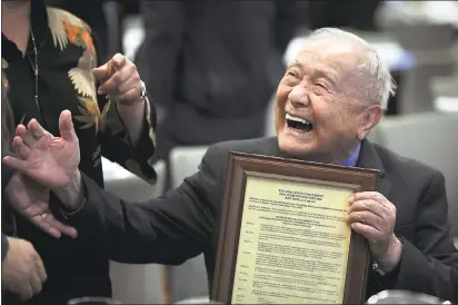  ?? LIPO CHING — STAFF PHOTOGRAPH­ER ?? San Jose State University judo coach Yoshihiro Uchida smiles after receiving a copy of the Senate Resolution to honor him for his 70years of service coaching judo for the University, at the Diaz Compean Student Union at San Jose State University.