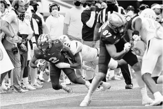  ?? HYOSUB SHIN/AJC ?? UCF running back Otis Anderson (2) has been a crucial part of the Knights’ success splitting time at tailback, slot receiver and punt returner.