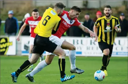  ??  ?? HONOURS EVEN: Harrogate’s Ben Parker and Salford’s Matt Warburton jostle for the ball