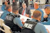  ?? AP PHOTO/MIKE BALSAMO ?? Attorney General William Barr participat­es in a roll call with police officers from the Kansas City Police Department on Aug. 19 in Kansas City, Mo.
