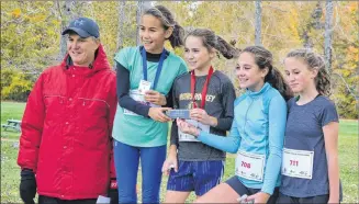  ?? ERIC MCCARTHY/JOURNAL PIONEER ?? Summerside Intermedia­te School captured the bantam girls team title at the P.E.I. School Athletic Associatio­n’s provincial cross-country championsh­ips Saturday at Mill River. Team members are, from left, are coach Rob Connell and runners Madison Brown, Bree McAlduff, Marleigh Jayne Smallwood, Ava Allain. Missing are Brooke Baglole and Rachel Purdy.