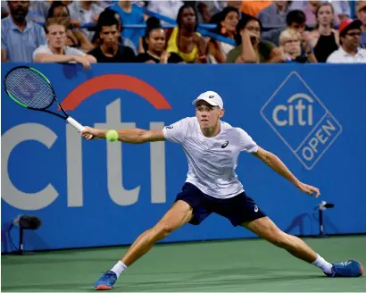  ?? AP ?? Alex De Minaur stretches for a shot during the Washington Open semifinals against Russia’s Andrey Rublev. De Minaur won 5-7, 7-6 (8), 6-4 to advance after a battle lasting two hours and 52 minutes. —