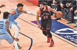  ?? JUSTIN FORD/USA TODAY SPORTS ?? Raptors guard Fred VanVleet (23) handles the ball against Grizzlies guard Dillon Brooks (24) during the first half on Monday.