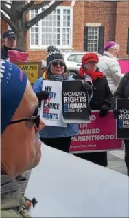  ??  ?? Protest signs were held high at the Historic Chester County Courthouse in West Chester Saturday during a rally for women’s health care rights.