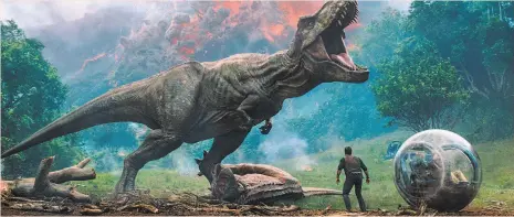  ?? Universal Pictures ?? Dinosaurs roar back to life in “Jurassic World: Fallen Kingdom.”