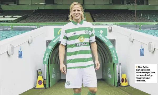  ??  ?? 2 New Celtic signing Moritz Bauer emerges from the tunnel during his unveiling at Parkhead.