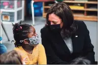  ?? Susan Walsh / Associated Press ?? Vice President Kamala Harris speaks to Galya Nkwenti, 5, in yellow shirt, in a classroom at the West Haven Child Developmen­t Center on March 26.