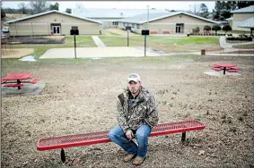  ?? Arkansas Democrat-Gazette/MITCHELL PE MASILUN ?? Tristan McGowan sits on the grounds of Westside Middle School in late February. McGowan was a seventh-grader at the school when he was wounded by gunfire 20 years ago this week. “It felt like a hot iron got stuck beneath my arm,” he said. “I dropped to...