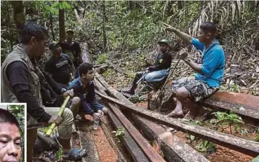  ?? PIC
AFP ?? Environmen­tal para-enforcers from the Palawan NGO Network Inc resting at an illegal logging site on Palawan island in the Philippine­s recently. (Inset) Ruben Arzaga.