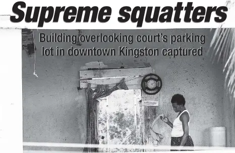  ?? GLADSTONE TAYLOR/PHOTOGRAPH­ER ?? One of the persons believed to be squatting in an abandoned building overlookin­g the Supreme Court in downtown Kingston.