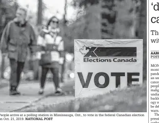  ?? NATIONAL POST ?? People arrive at a polling station in Mississaug­a, Ont., to vote in the federal Canadian election on Oct. 21, 2019.