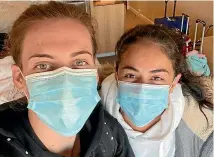  ?? SUPPLIED ?? Megan Oliver, 22, and Ana Santos, 30, staying at the Jet Park Hotel quarantine facility in Auckland this week after returning from the UK.