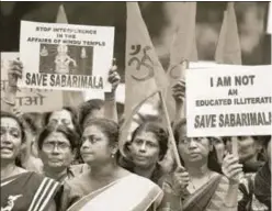  ??  ?? Members of the Ayyappa Dharma Samrakshan­a Samithi hold placards during a protest in New Delhi against the Supreme Court verdict on the entry of women of all ages into the Ayyappa Temple in Sabarimala, October 14 AMAL KS/HT PHOTO