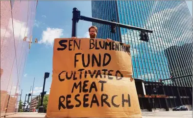  ?? Jon Hochschart­ner / Contribute­d photo ?? Jon Hochschart­ner protests outside Sen. Richard Blumenthal’s Hartford office.