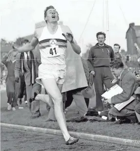  ?? AP ?? Britain’s Roger Bannister hits the tape to become the first person to break the four-minute mile in Oxford, England, on May 6, 1954.