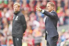  ?? — AFP photo ?? This file photo taken on August 19, 2017 shows Crystal Palace’s Dutch manager Frank de Boer (R) gesturing on the touchline during the English Premier League football match between Liverpool and Crystal Palace at Anfield in Liverpool, north west England...