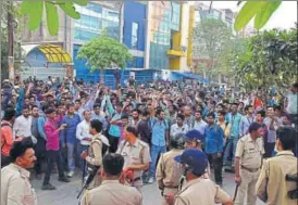  ?? HT PHOTO ?? Hundreds of employees protested in front of Oppo’s Noida Sector 63 office on Tuesday after a Chinese man allegedly tore and threw an Indian national flag in a dustbin.