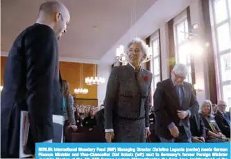  ??  ?? BERLIN: Internatio­nal Monetary Fund (IMF) Managing Director Christine Lagarde (center) meets German Finance Minister and Vice-Chancellor Olaf Scholz (left) next to Germany’s former Foreign Minister Joschka Fischer at the 4th DIW Europe Lecture “Strengthen­ing the Euro Area Architectu­re” at the German Institute for Economic Research DIW in Berlin, yesterday. —AFP