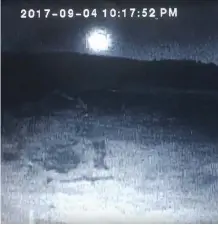  ?? THE CANADIAN PRESS/YOUTUBE-JACQUIE MCKAY ?? A YouTube video taken from a security camera in Bridge Lake, B.C. shows the fireball Sept. 4.