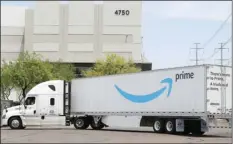  ?? AP PHOTO/ROSS D. FRANKLIN ?? This July 17, 2019, file photo shows an Amazon shipping truck at a fulfillmen­t center in Phoenix. Amazon said Tuesday, that it will only accept from suppliers shipments of cleaning equipment, medical supplies and household goods at its warehouses for next three weeks to fill surging demand of those items.